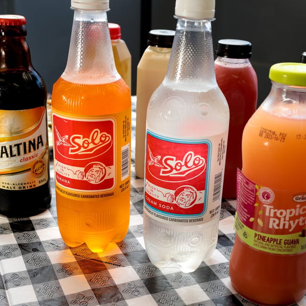 A variety of Caribbean beverages, including Solo banana and cream sodas, and Tropic Rhythms pineapple guava juice.